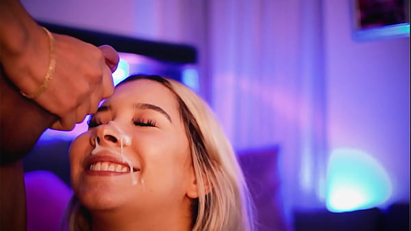 Blonde with a beautiful face sucks her friend'_s cock while transmitting and receives a big load of cum on her face